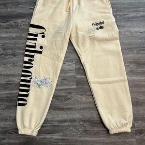 Cream Track Pants with Elastic Cuffs and Graphic Design